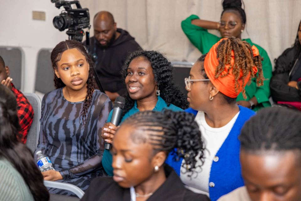 An attendee asking a question from the floor