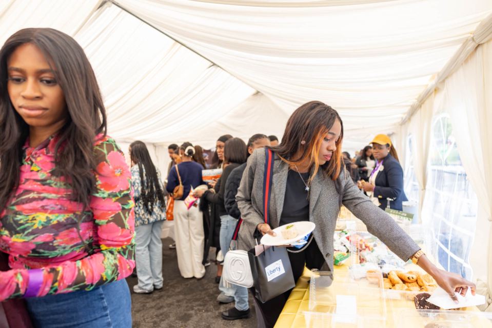 Attendees networking in the marquee