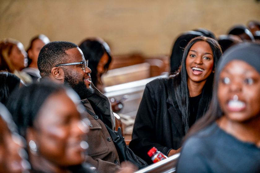 Attendees laughing together during a session